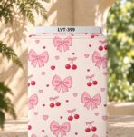 Cute pink bows, cherries and tiny hearts on a soft cream background.