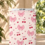 Cute pink bows, cherries and tiny hearts on a soft cream background.