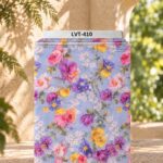 Colorful vintage florals in pink, purple and yellow on a soft blue background.