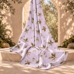 Delicate botanical print with soft ivory flowers and golden-green leaves on a light lavender background. - Image 2