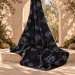 Delicate blue floral clusters with subtle golden centers on a deep black background. - Image 2