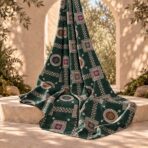 Ornamental geometric motifs in ivory and jewel tones on a deep green background. - Image 2
