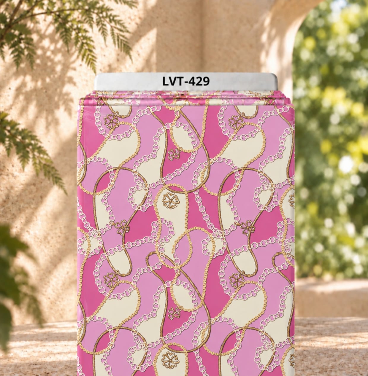 LVT-429 Elegant interlocking chain motif with delicate charm details on a soft pink and cream background. - Image 1