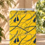 Luxury chain and tassel print in royal blue and gold on a vibrant yellow background.