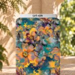 Artistic watercolor floral print in orange, teal, yellow and grey tones.