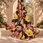 Bold botanical floral print in yellow, pink and orange on a deep burgundy background. - Image 2