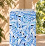 Flowing abstract print in layered blue, aqua, white and black tones.