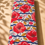 Bold red blooms with golden leaves, navy waves, and playful dots - Swiss Cotton (PC01)